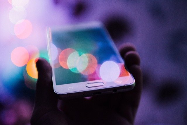educational technology - hand holding mobile phone